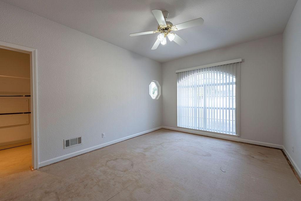 10246 Ranch Road Rough and Ready, CA 95975 - Photo 29 of 69 an empty room with windows and closet