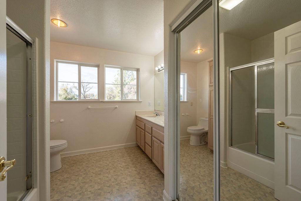 10246 Ranch Road Rough and Ready, CA 95975 - Photo 44 of 69 a bathroom with a bathtub and a shower