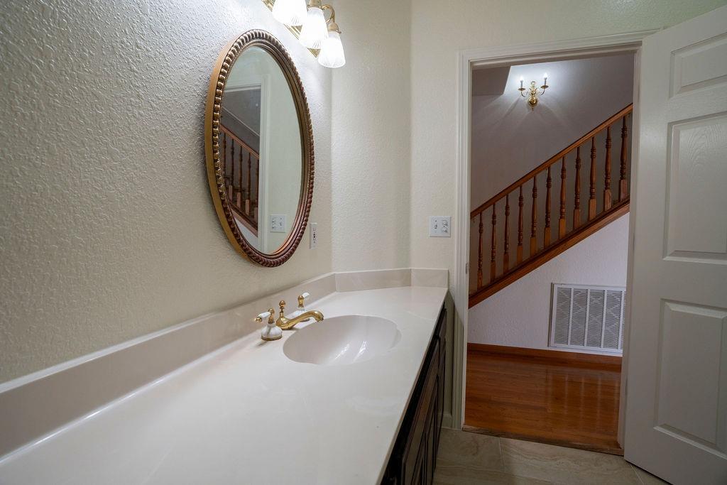 10246 Ranch Road Rough and Ready, CA 95975 - Photo 53 of 69 a bathroom with a sink and a mirror