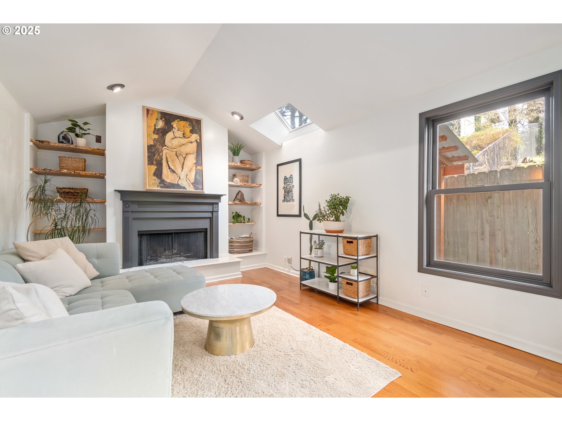 2765 Kismet Way Eugene, OR 97405 - Photo 12 of 46 a living room with furniture a fireplace and a large window