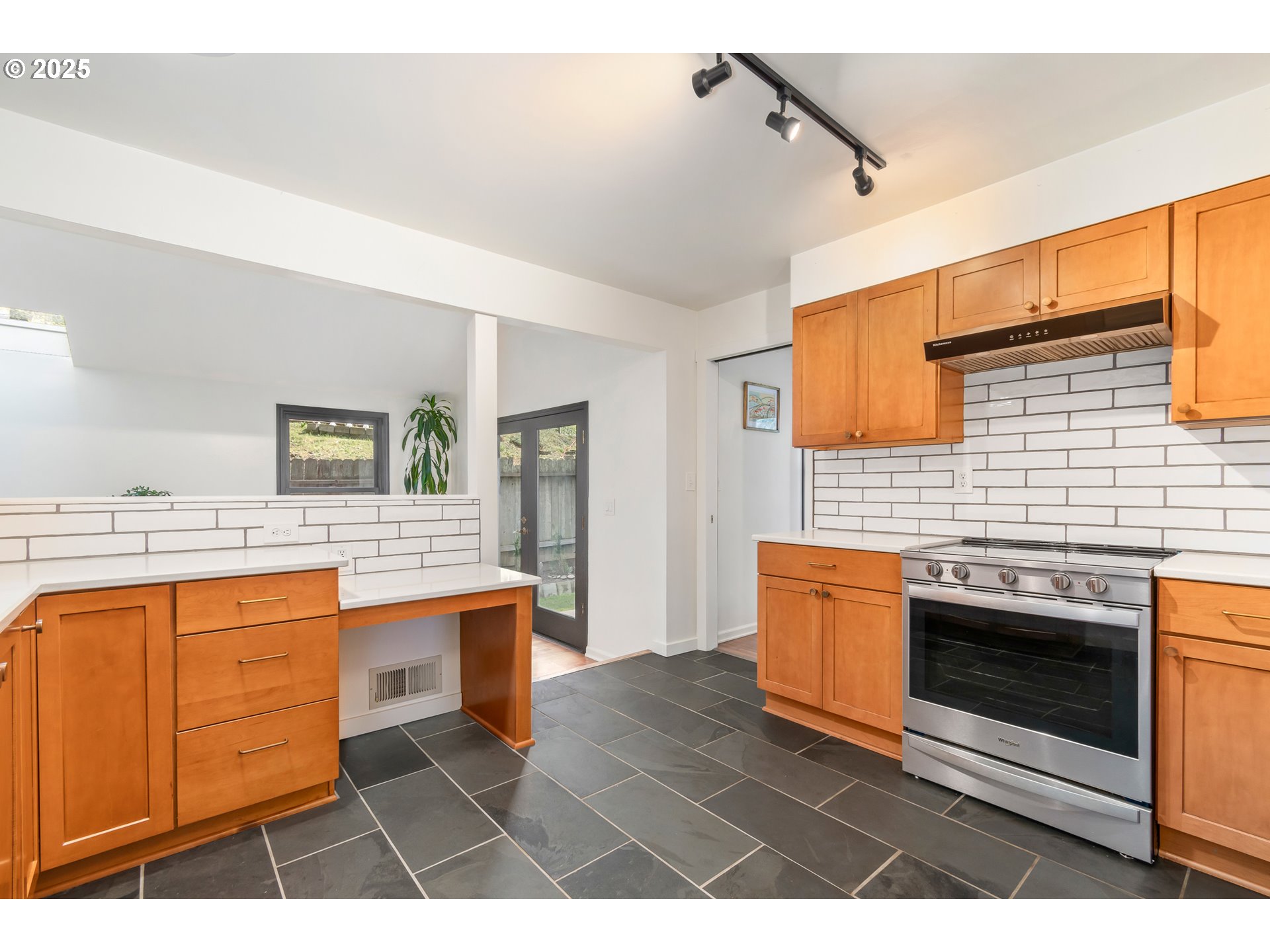 2765 Kismet Way Eugene, OR 97405 - Photo 14 of 46 a kitchen with stainless steel appliances granite countertop a stove a sink and a refrigerator
