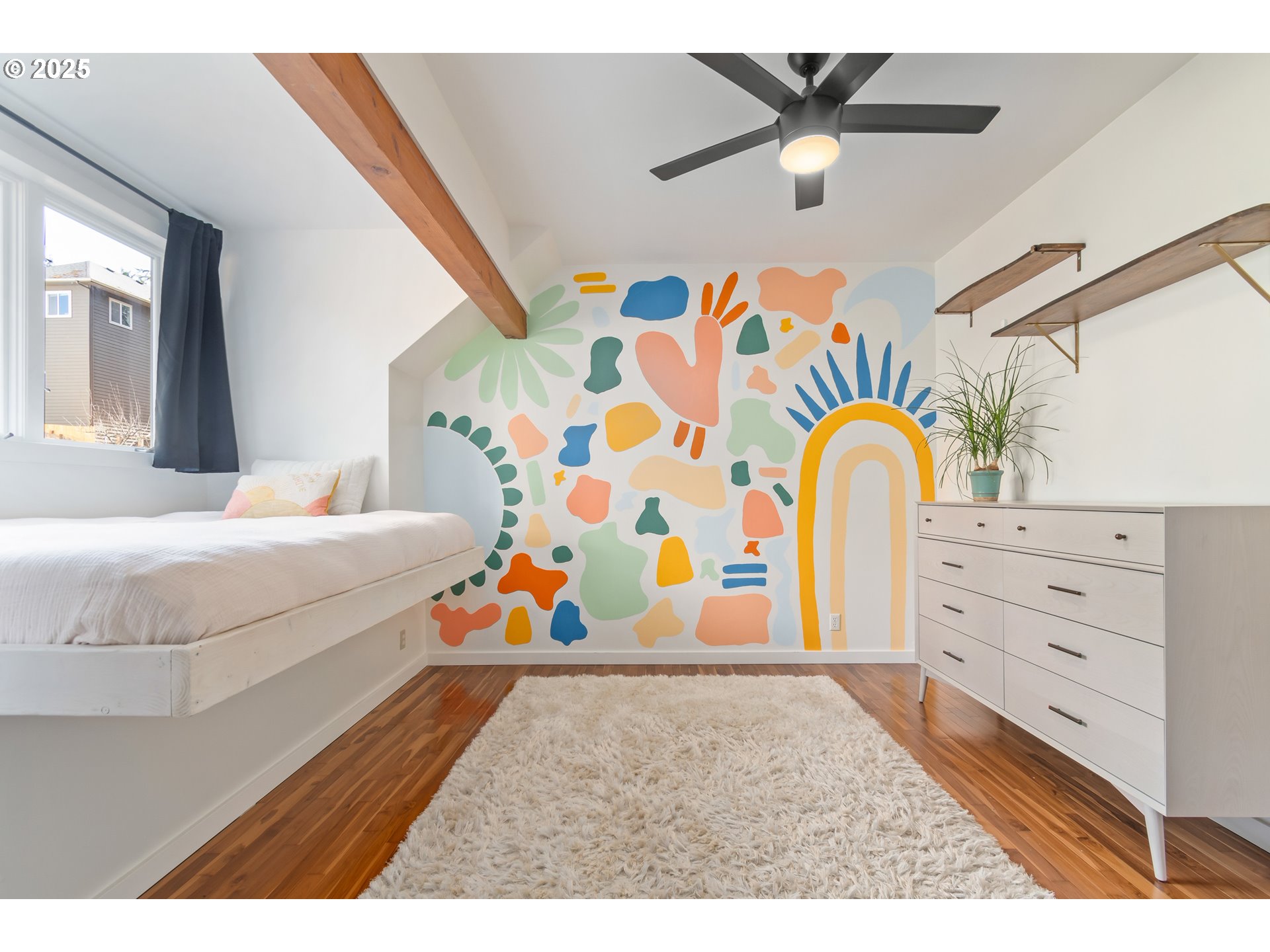 2765 Kismet Way Eugene, OR 97405 - Photo 31 of 46 a bedroom with a bed and a chandelier