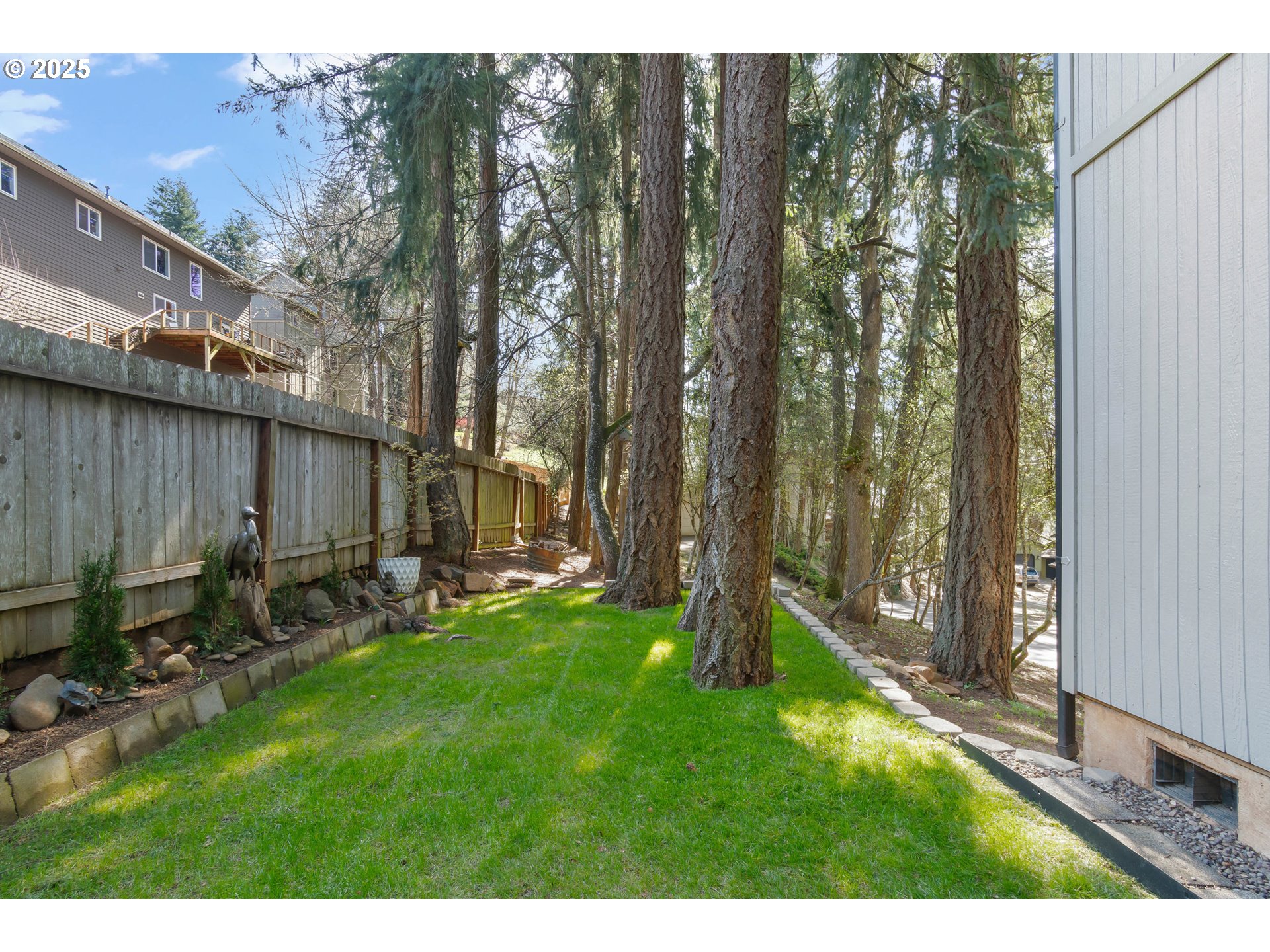 2765 Kismet Way Eugene, OR 97405 - Photo 38 of 46 a backyard of a house with lawn chairs and wooden fence