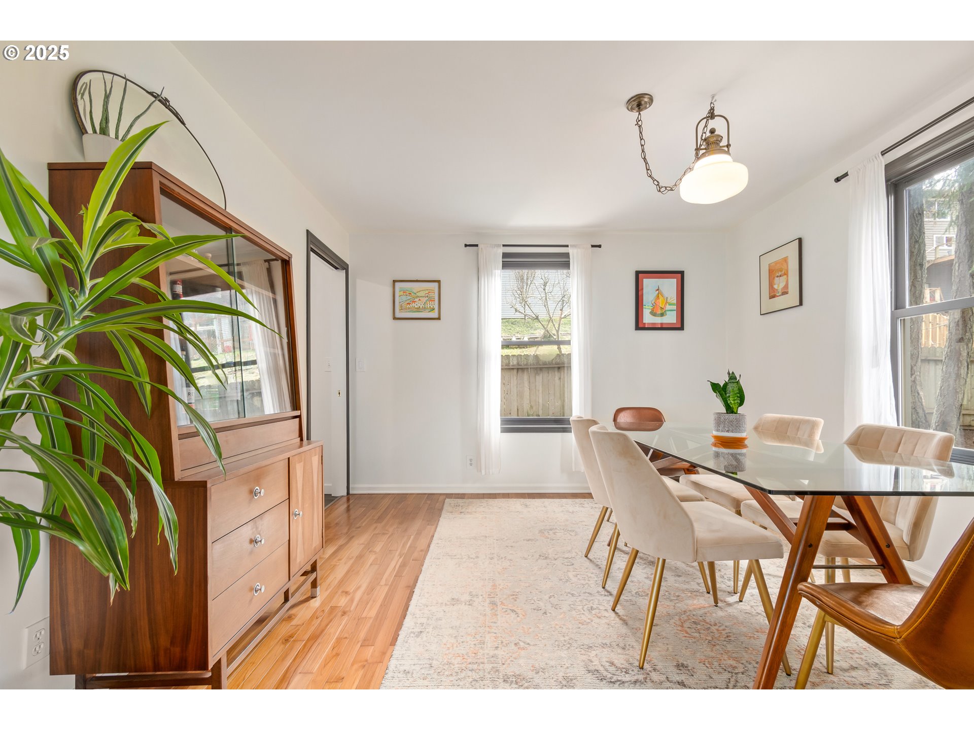 2765 Kismet Way Eugene, OR 97405 - Photo 8 of 46 a view of a dining room with furniture and a potted plant