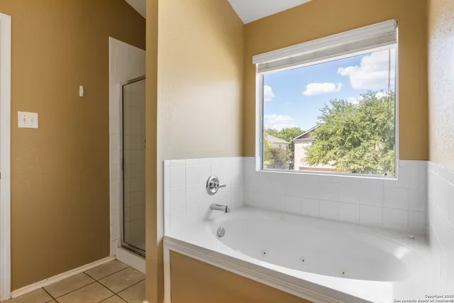 a bath tub sitting next to a window