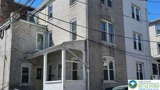 a view of a building with a street