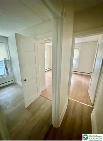 a bathroom with a glass shower door