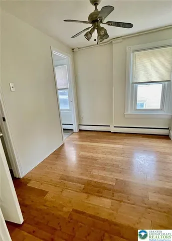 a bathroom with a sink a toilet a walk in closet