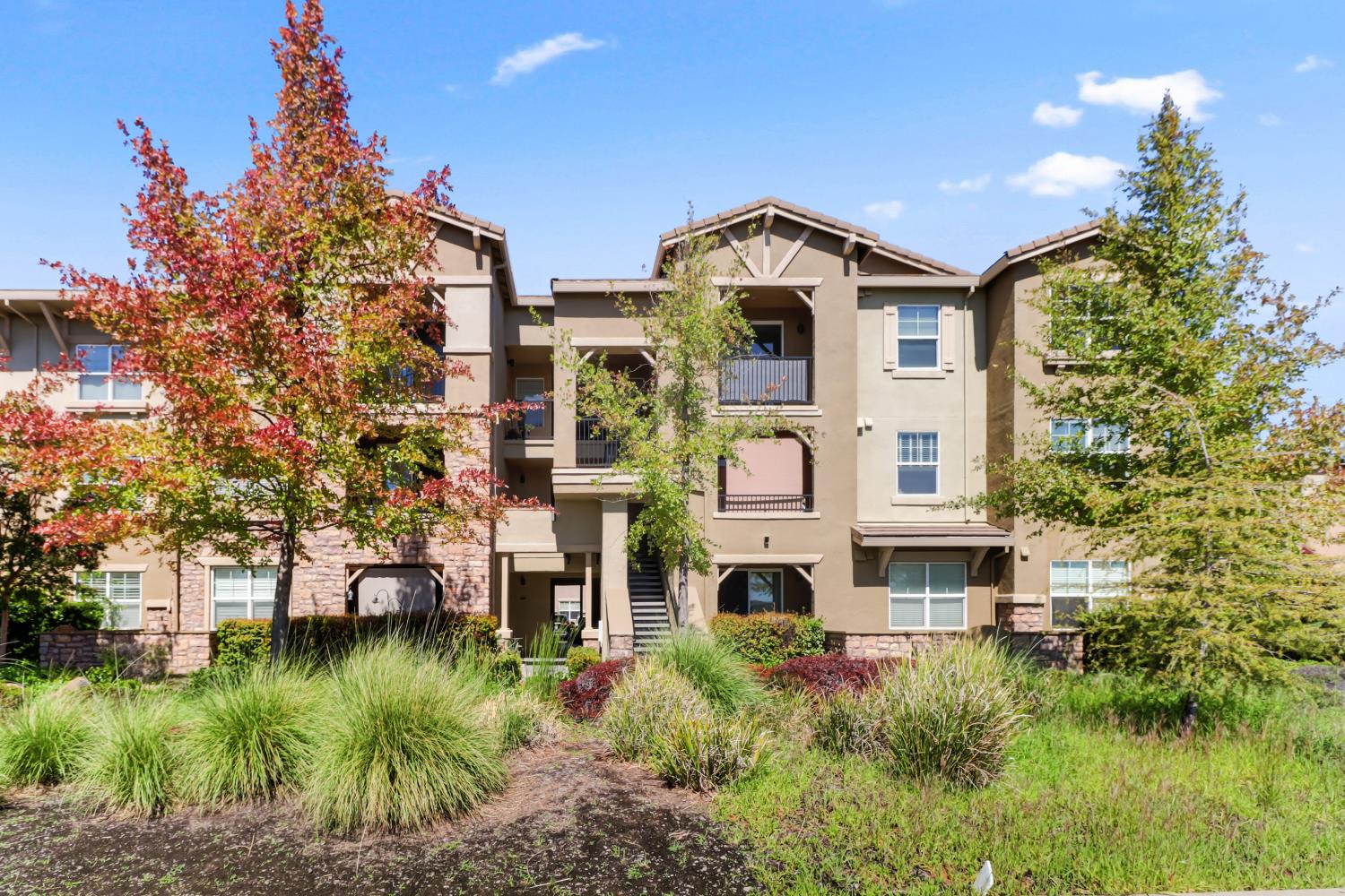 a aerial view of a house with a yard