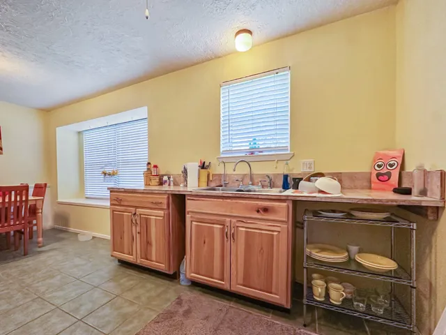 a kitchen with stainless steel appliances granite countertop a sink and cabinets