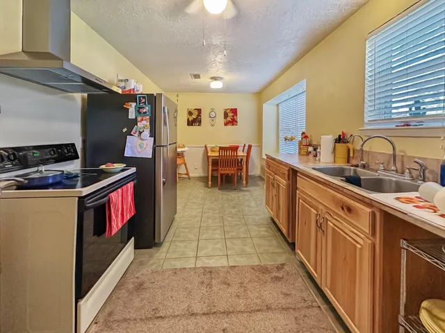 a kitchen with stainless steel appliances granite countertop lots of counter top space