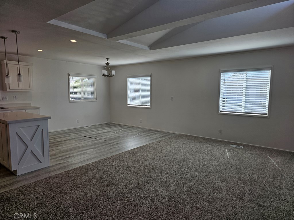 1560 Massachusetts Avenue, Unit 94 Riverside, CA 92507 - Photo 11 of 14 an empty room with windows