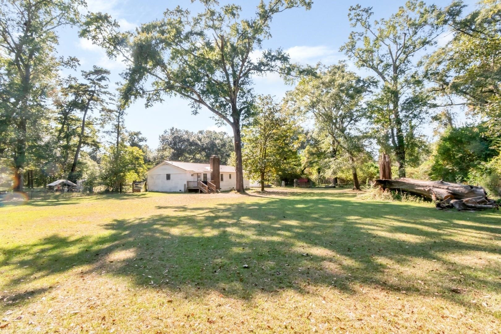 6405 1st Street Wilmer, AL 36587 - Photo 29 of 38 View of grassy yard featuring view of scattered trees