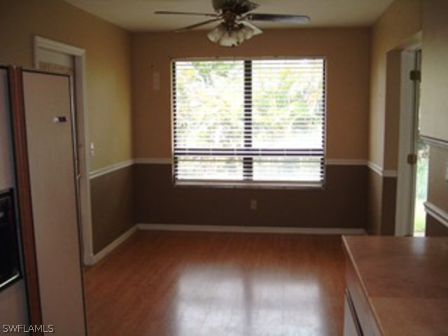 18293 Lee Road Fort Myers, FL 33967 - Photo 4 of 12 a view of an empty room with a window