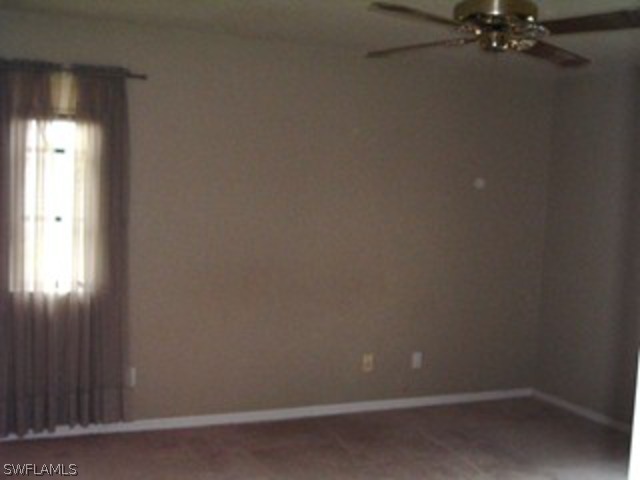18293 Lee Road Fort Myers, FL 33967 - Photo 6 of 12 a room that has a fan in it