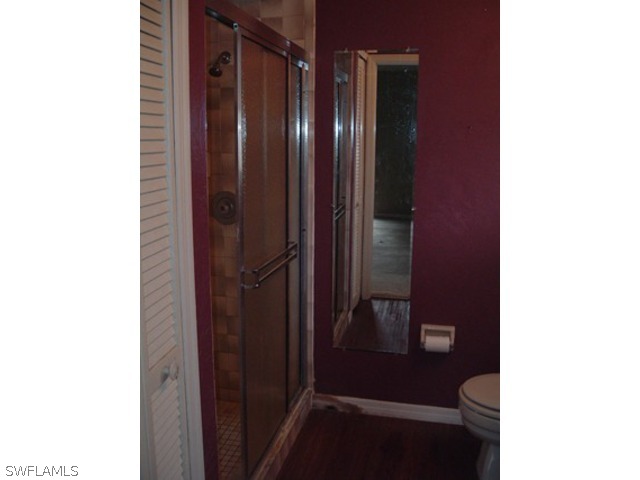 18293 Lee Road Fort Myers, FL 33967 - Photo 7 of 12 a bathroom with a sink and a toilet