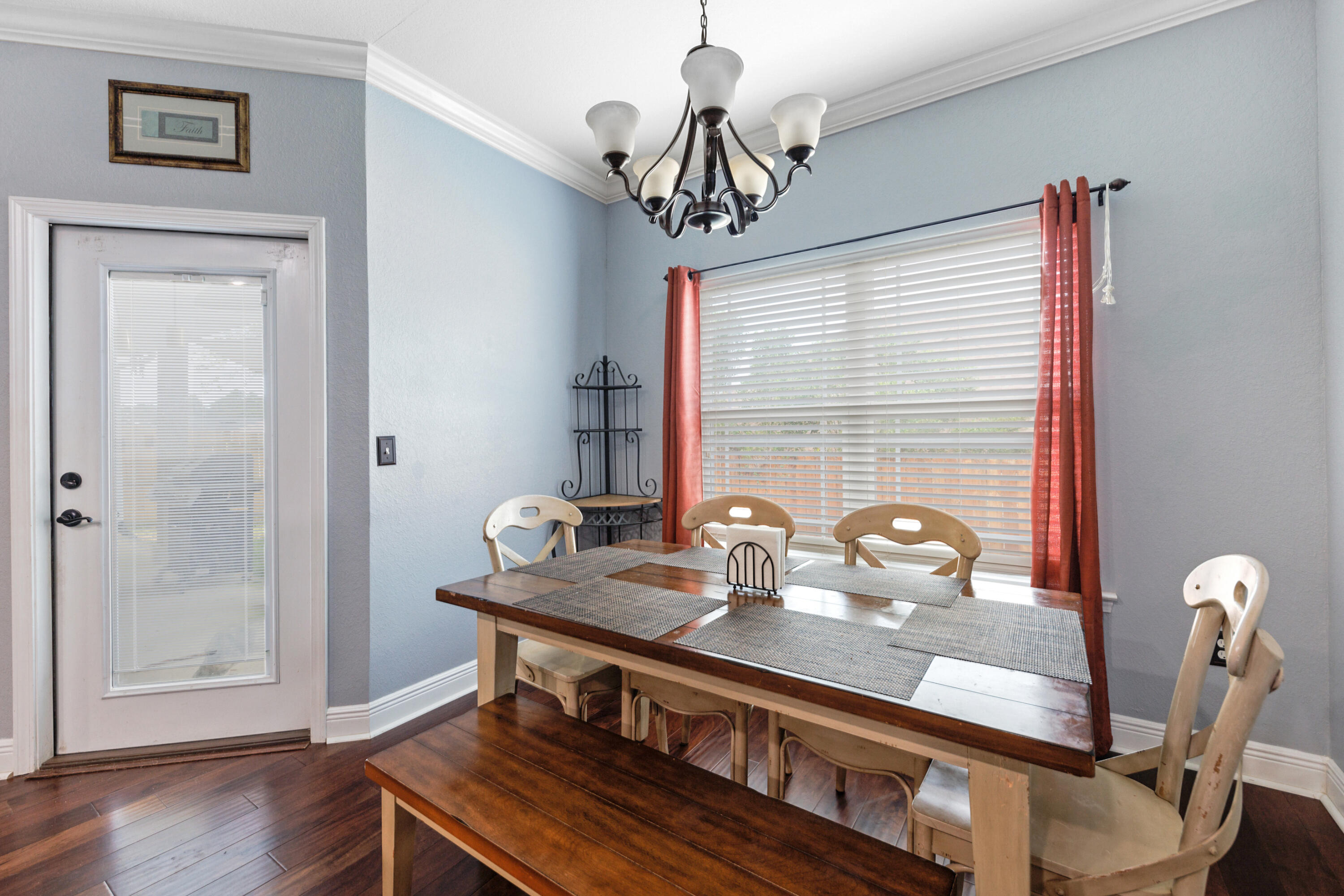 4417 Mirada Way Crestview, FL 32539 - Photo 15 of 37 a view of a dining room with furniture window and wooden floor