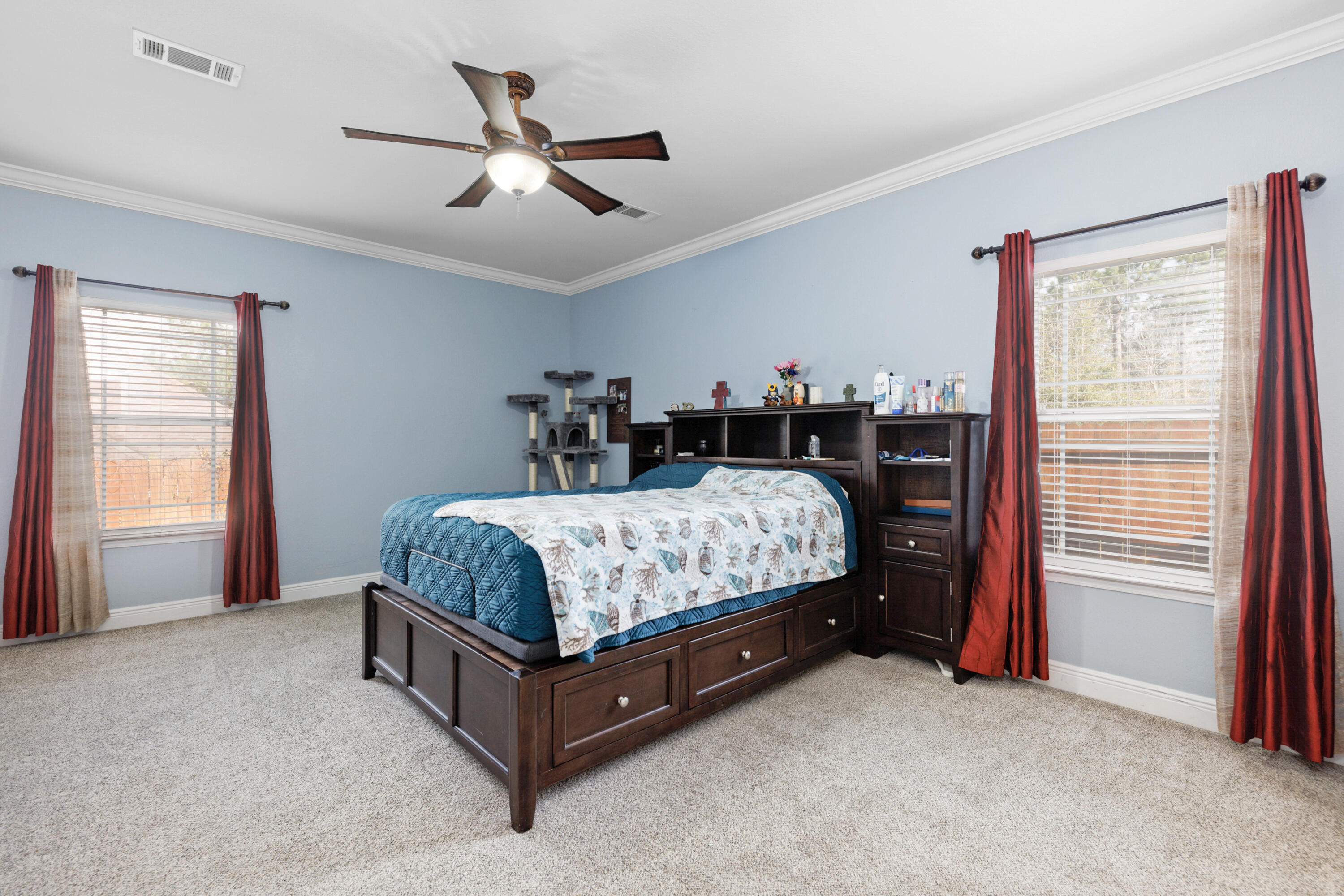 4417 Mirada Way Crestview, FL 32539 - Photo 18 of 37 a bed sitting in a bedroom next to a window