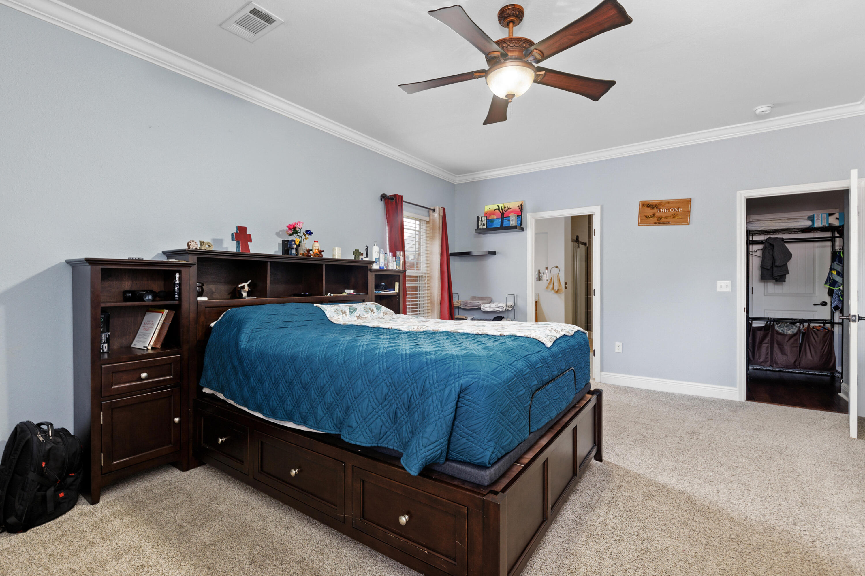 4417 Mirada Way Crestview, FL 32539 - Photo 19 of 37 a bedroom with a bed and a chandelier