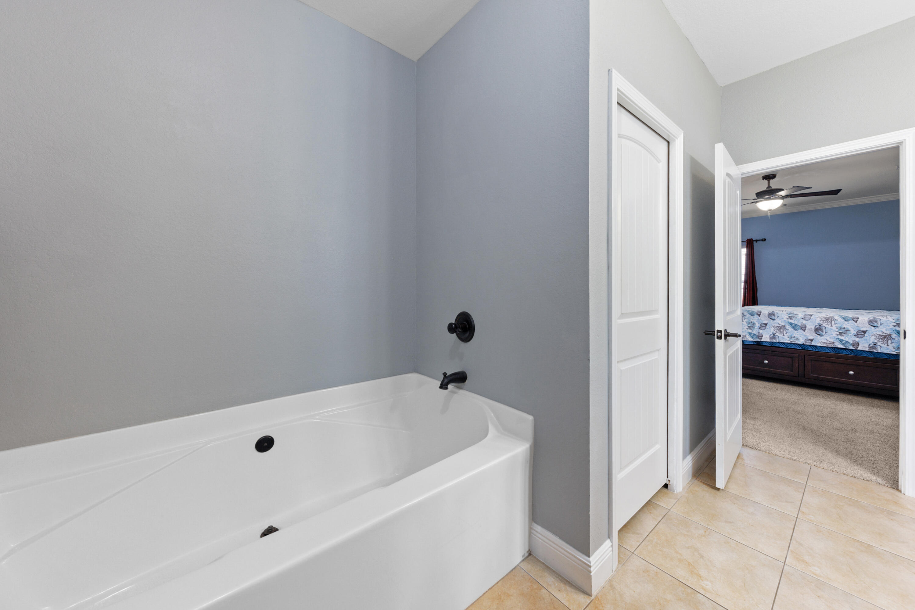 4417 Mirada Way Crestview, FL 32539 - Photo 23 of 37 a bathroom with a tub and a sink