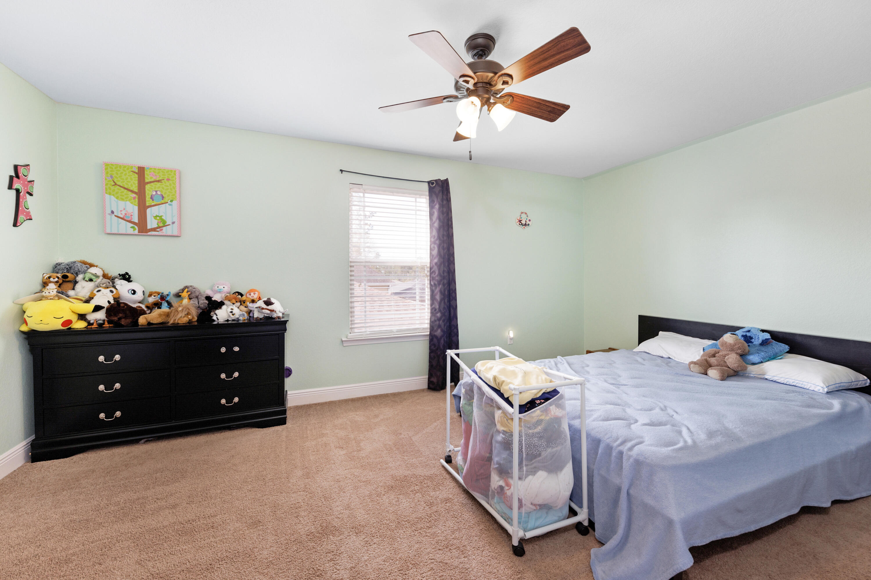 4417 Mirada Way Crestview, FL 32539 - Photo 27 of 37 a bedroom with a bed and a window