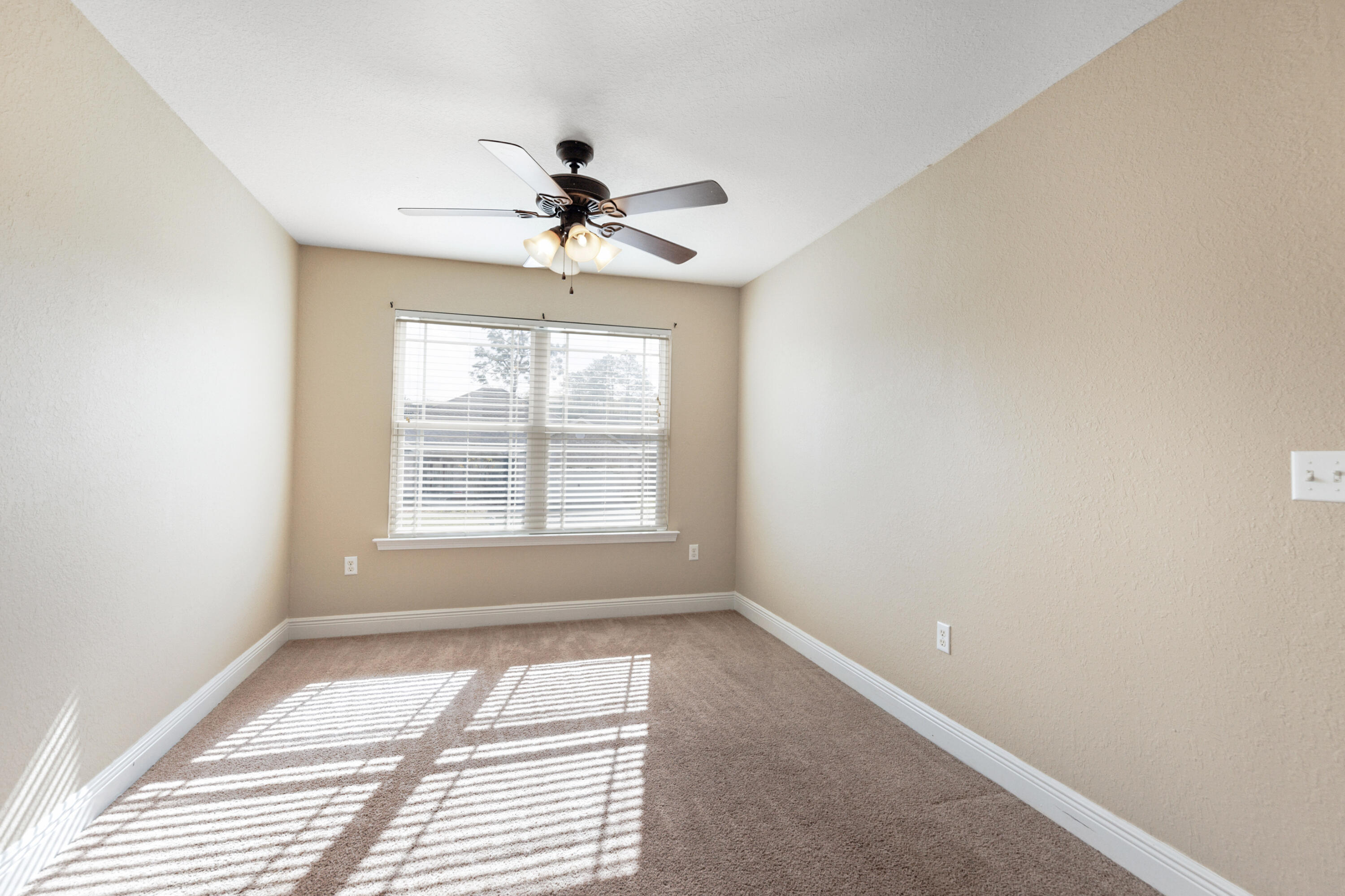 4417 Mirada Way Crestview, FL 32539 - Photo 29 of 37 a view of a room with a ceiling fan and window