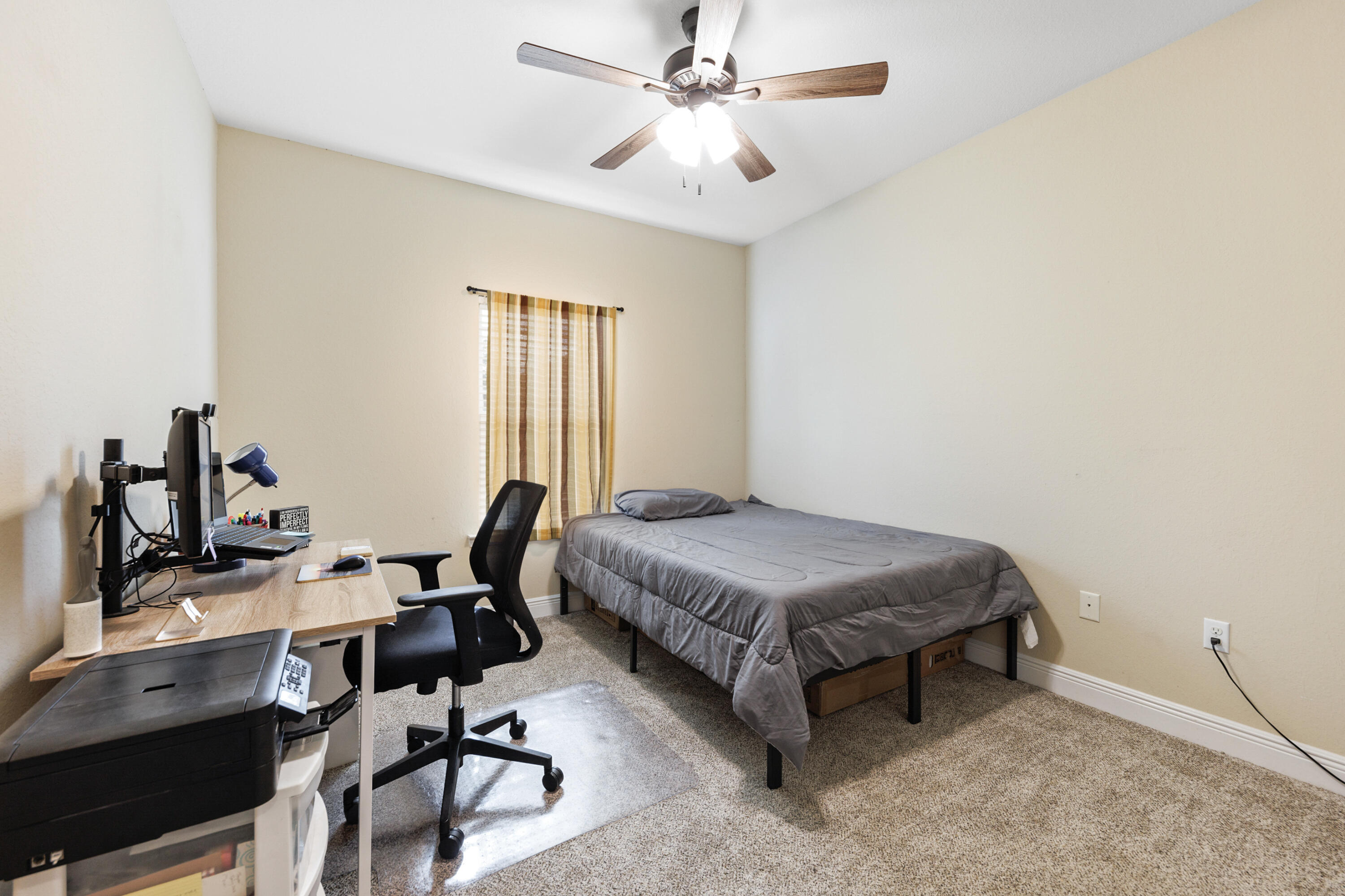 4417 Mirada Way Crestview, FL 32539 - Photo 30 of 37 a bedroom with a bed and a desk