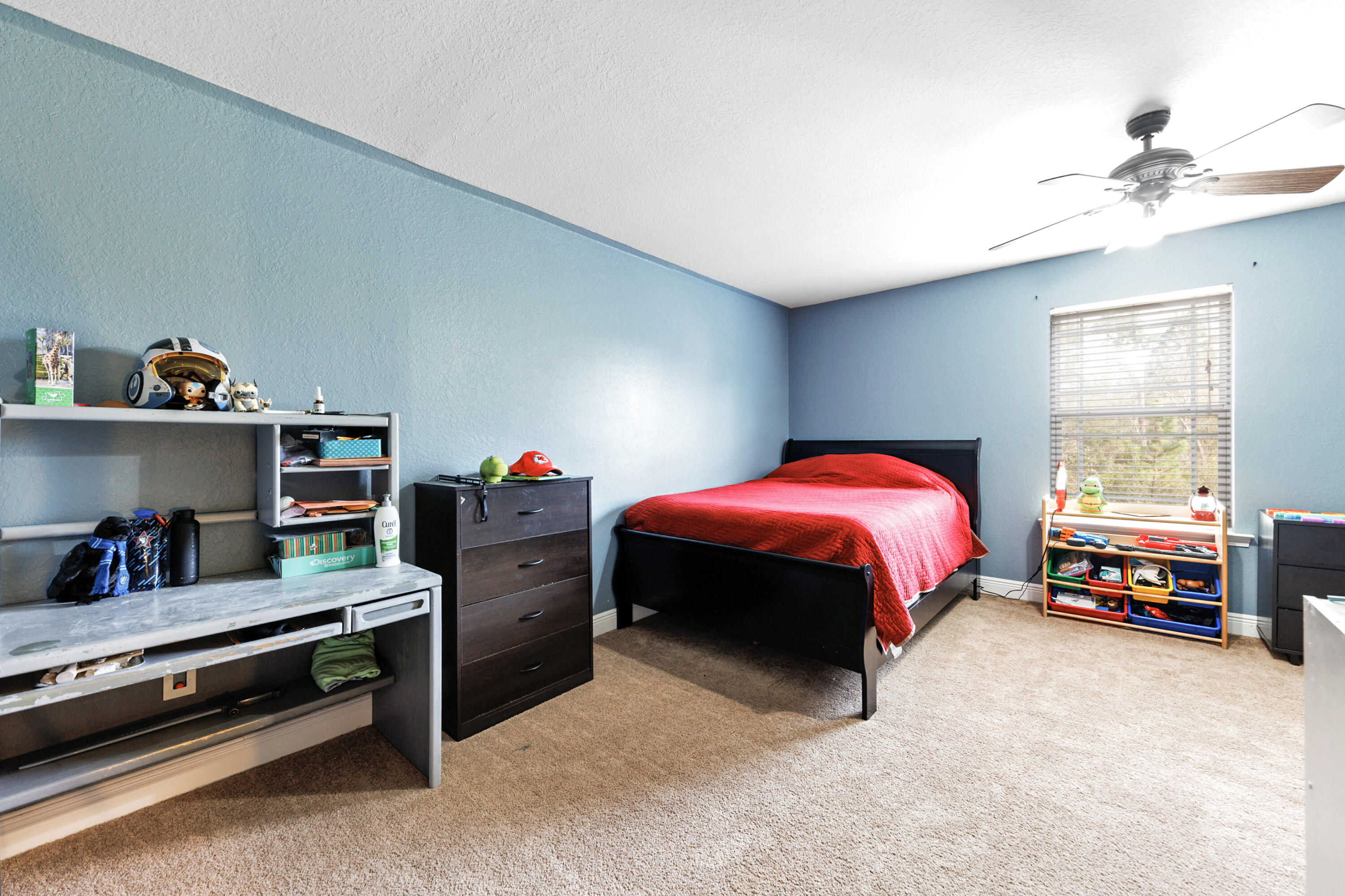 4417 Mirada Way Crestview, FL 32539 - Photo 32 of 37 a bedroom with a bed and a chandelier