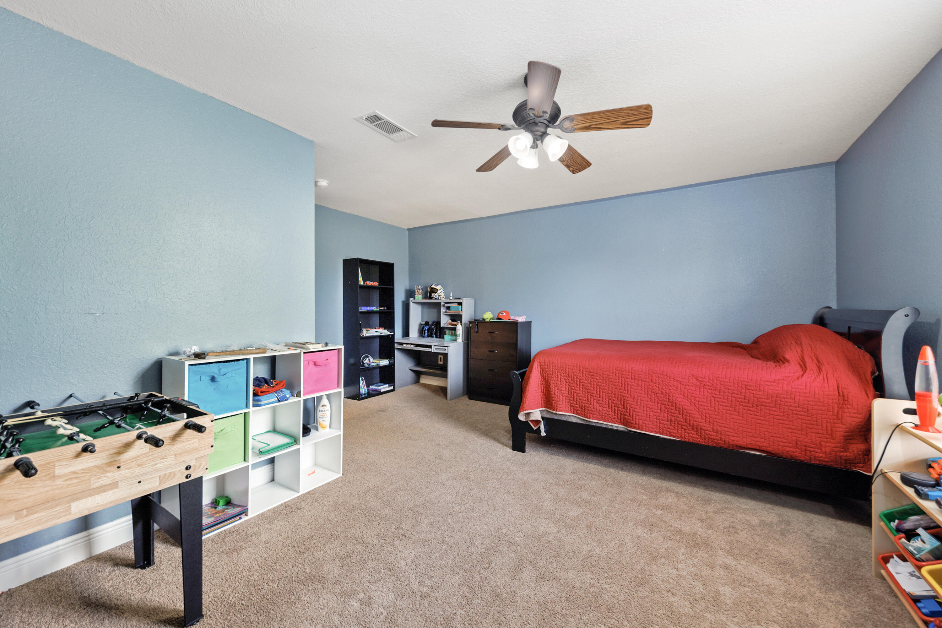 4417 Mirada Way Crestview, FL 32539 - Photo 34 of 37 a bedroom with a bed and a chandelier