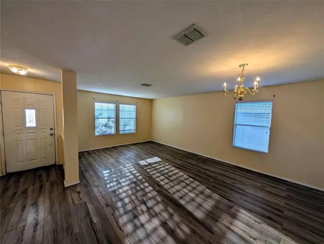 a view of an empty room and window