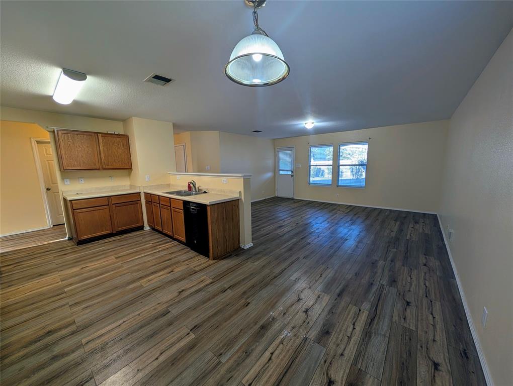 10811 Rindle Ranch San Antonio, TX 78249 - Photo 18 of 18 a room with wooden floors and ceiling fan