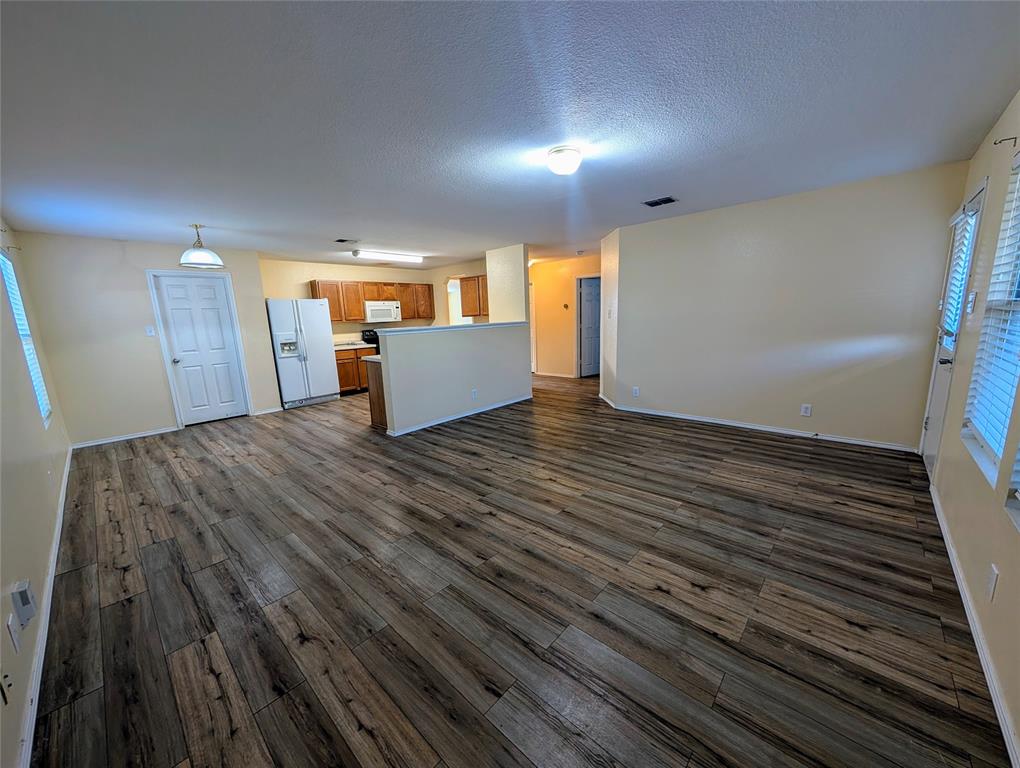 10811 Rindle Ranch San Antonio, TX 78249 - Photo 6 of 18 a view of a room with wooden floor