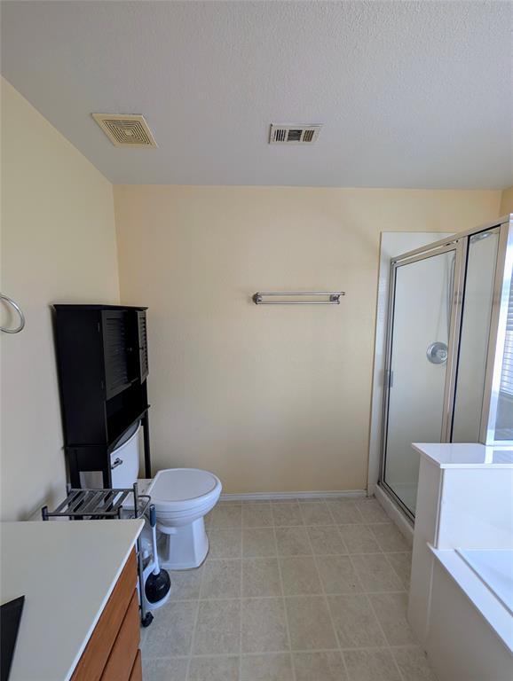 10811 Rindle Ranch San Antonio, TX 78249 - Photo 8 of 18 a bathroom with a toilet and a sink