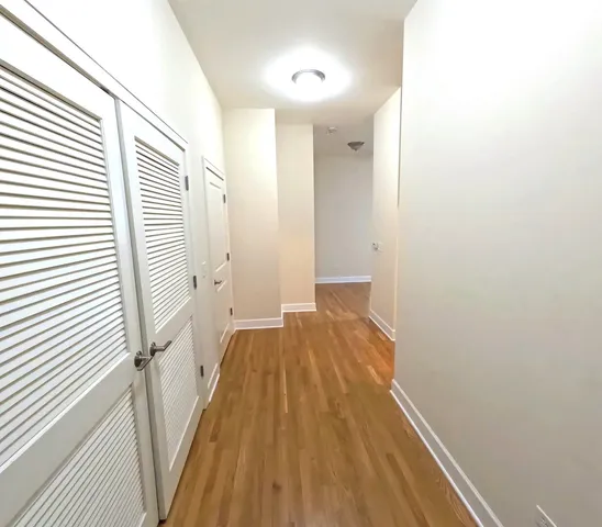 a view of a bathroom from a hallway