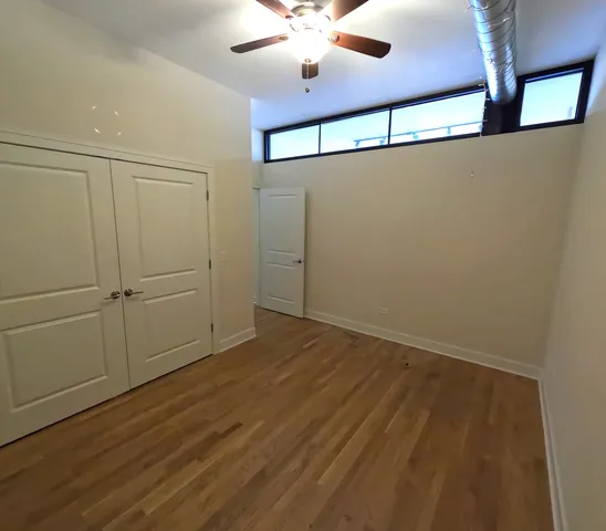 en empty room with wooden floor