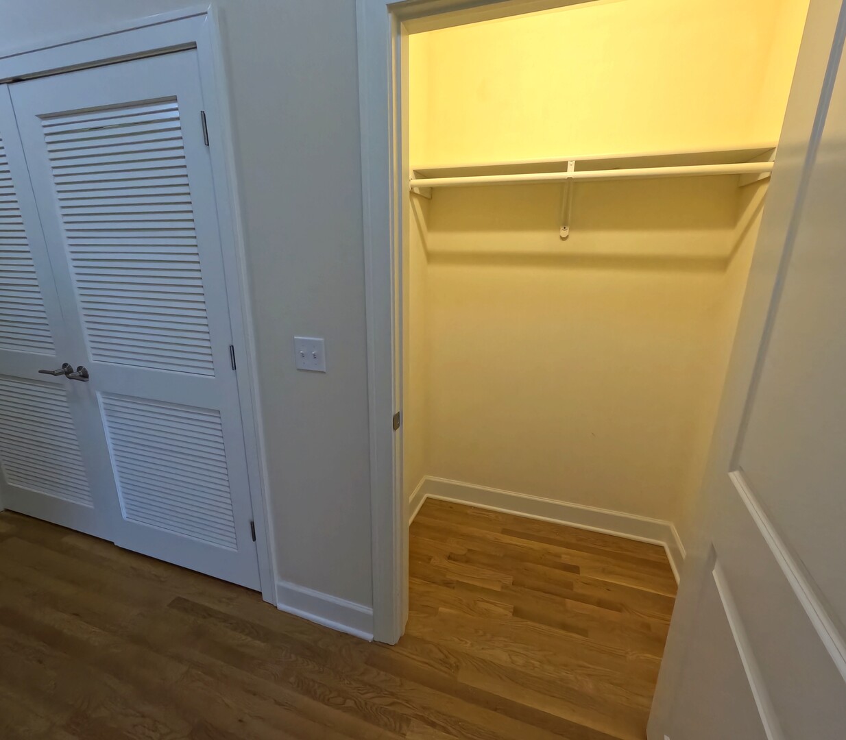 2778 North Milwaukee Avenue, Unit 308 Chicago, IL 60647 - Photo 6 of 18 a view of an empty room with wooden floor and a window