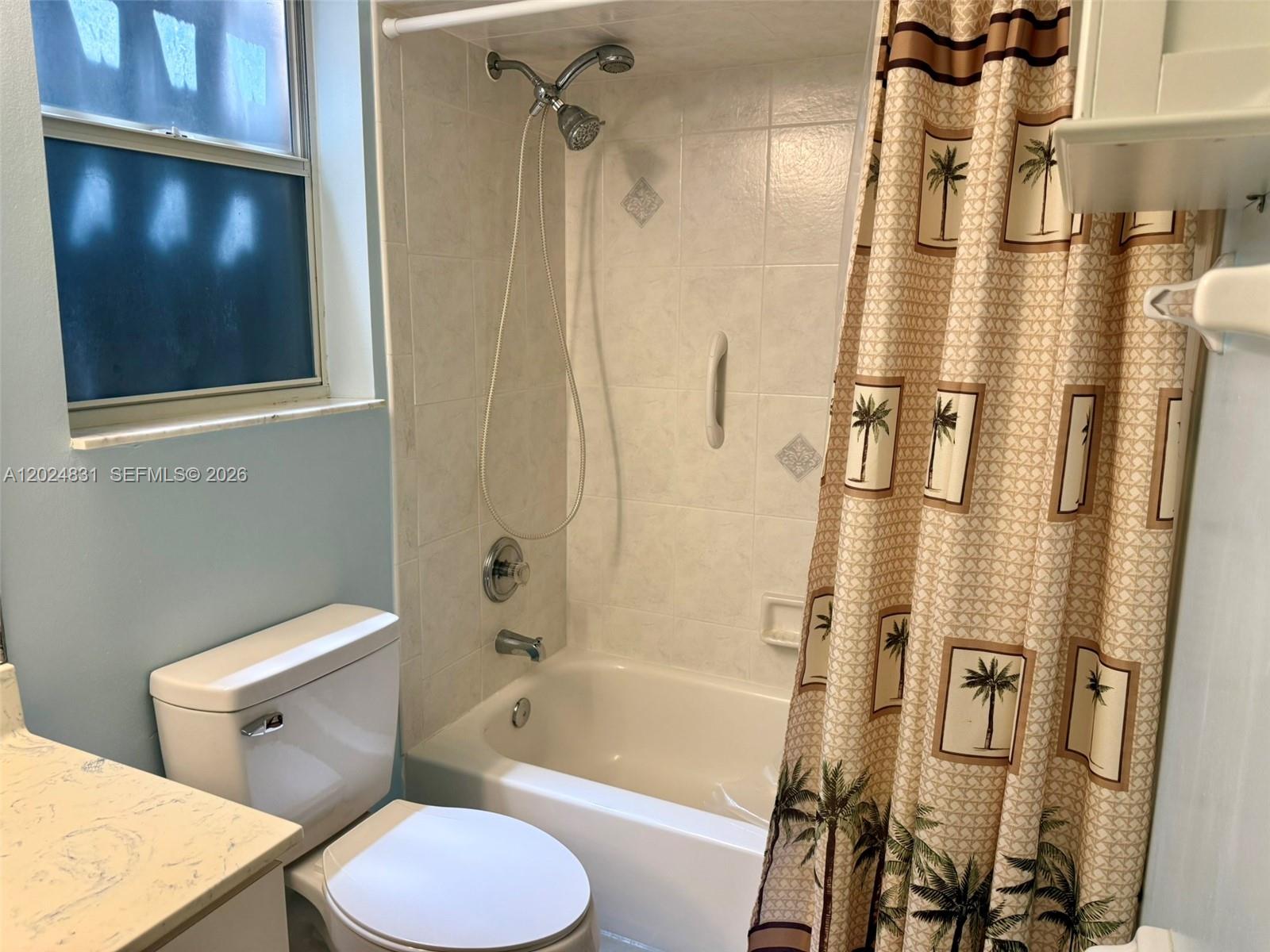 15819 76th Road North Loxahatchee, FL 33470 - Photo 37 of 45 a bathroom with a toilet and shower