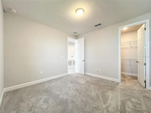 a living room with a bed furniture and a window