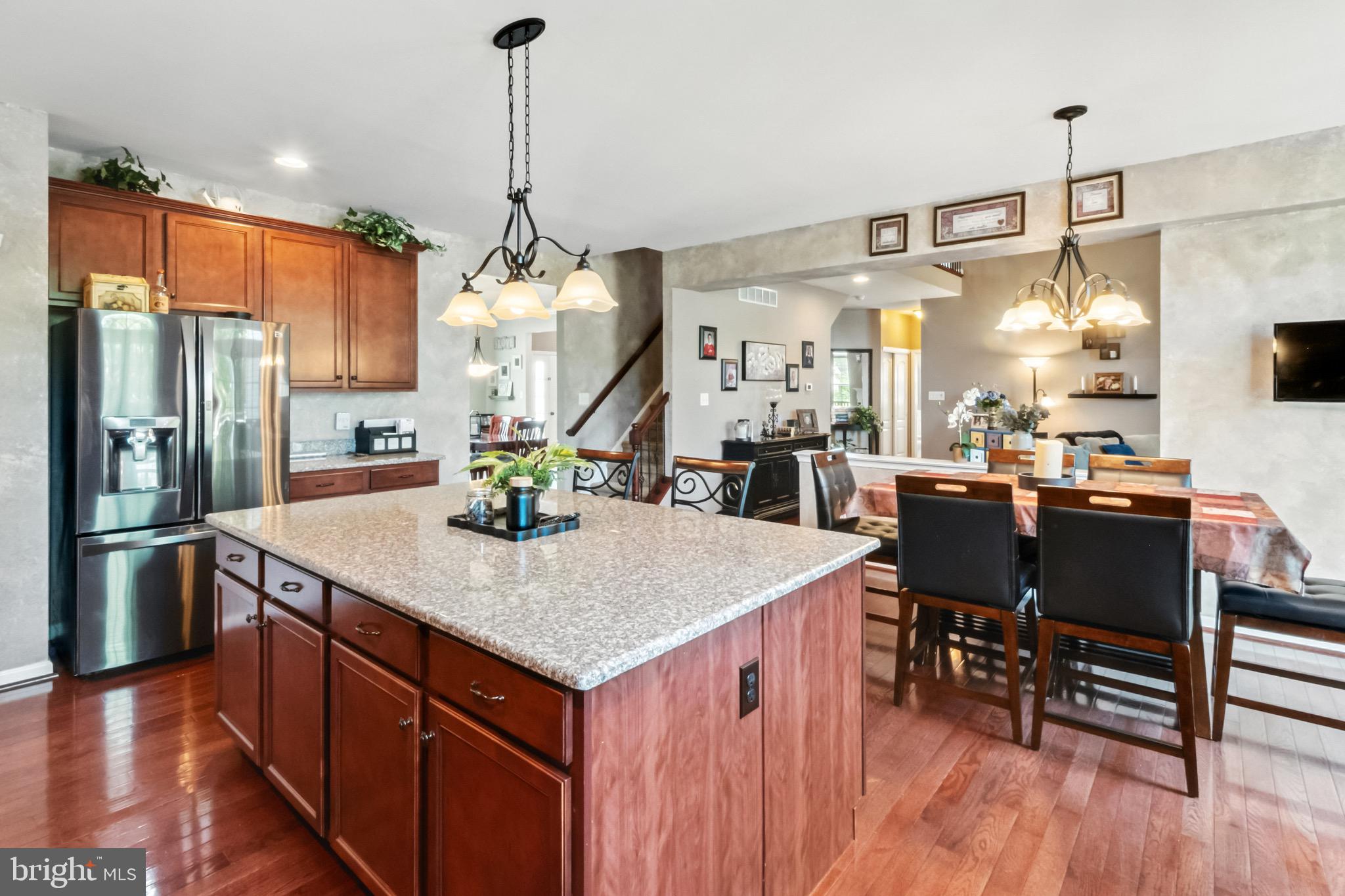 52 Forage Drive Mickleton, NJ 08056 - Photo 12 of 41 a kitchen with stainless steel appliances granite countertop a sink a stove and a refrigerator