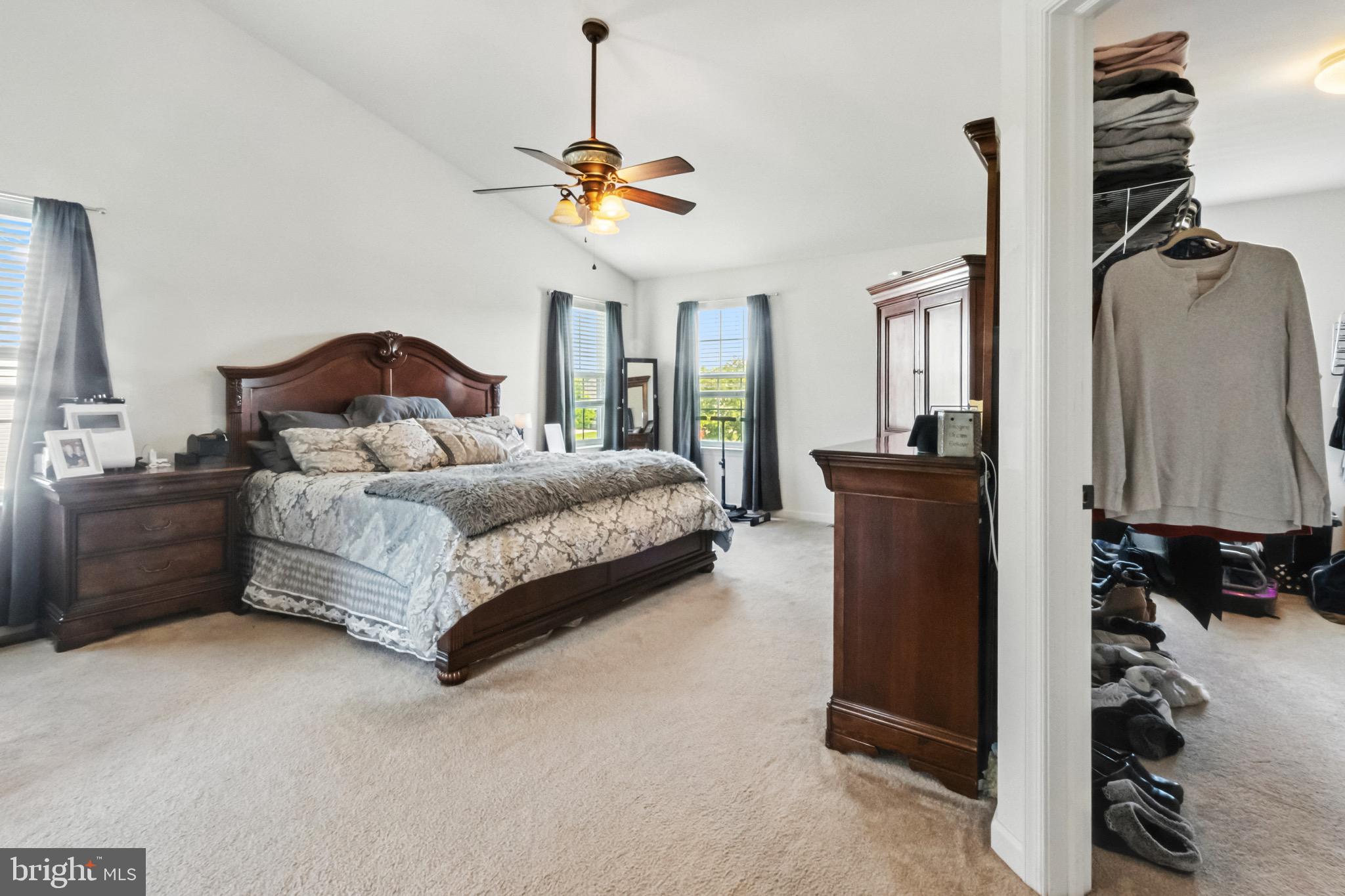52 Forage Drive Mickleton, NJ 08056 - Photo 24 of 41 a spacious bedroom with a bed and a chandelier