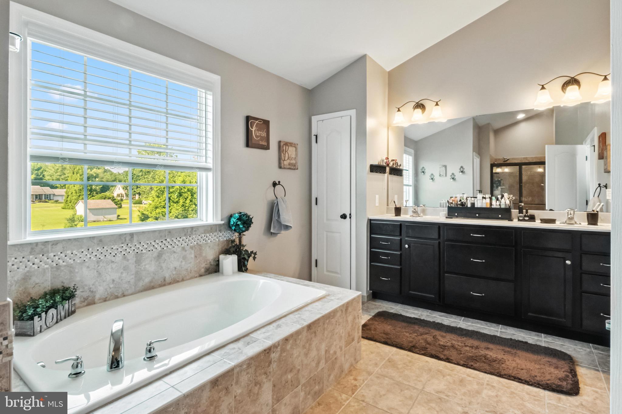 52 Forage Drive Mickleton, NJ 08056 - Photo 27 of 41 a spacious bathroom with a tub sink and mirror