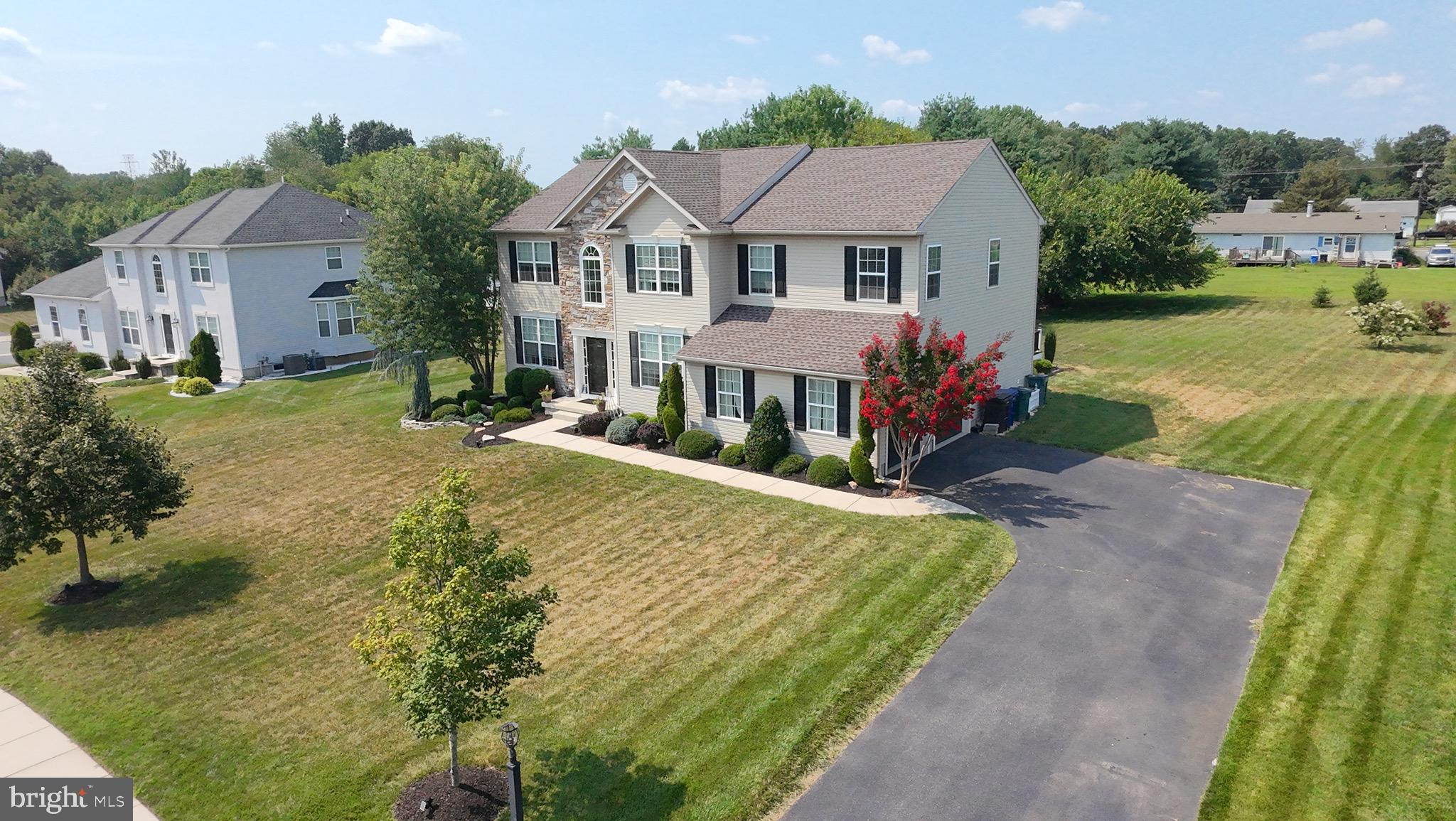 52 Forage Drive Mickleton, NJ 08056 - Photo 3 of 41 a front view of a house with garden