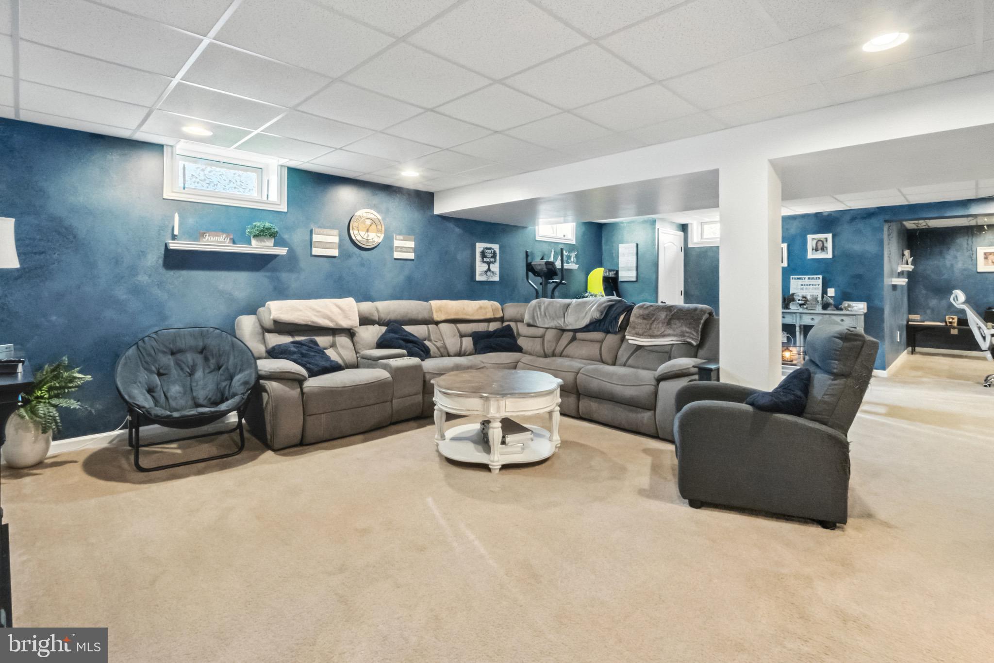 52 Forage Drive Mickleton, NJ 08056 - Photo 31 of 41 a living room with furniture and a chandelier