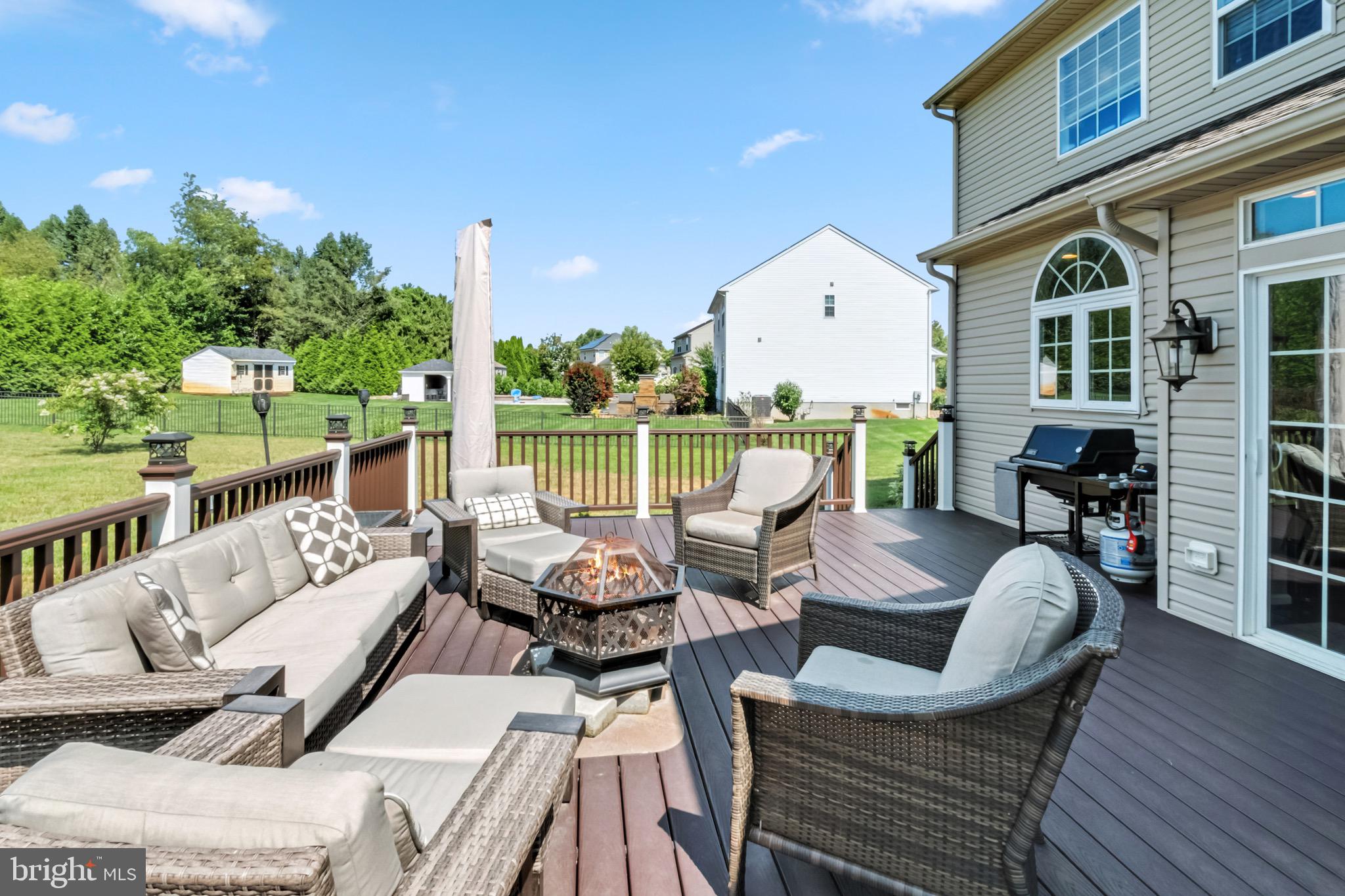 52 Forage Drive Mickleton, NJ 08056 - Photo 6 of 41 a view of a patio with couches dining table and chairs with wooden floor