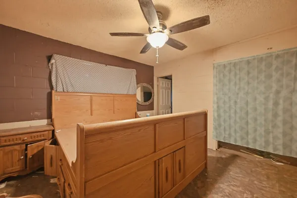 a bedroom with a bed and a cabinets