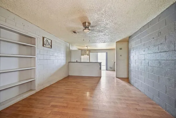 a view of a kitchen with a cabinet and a ceiling fan