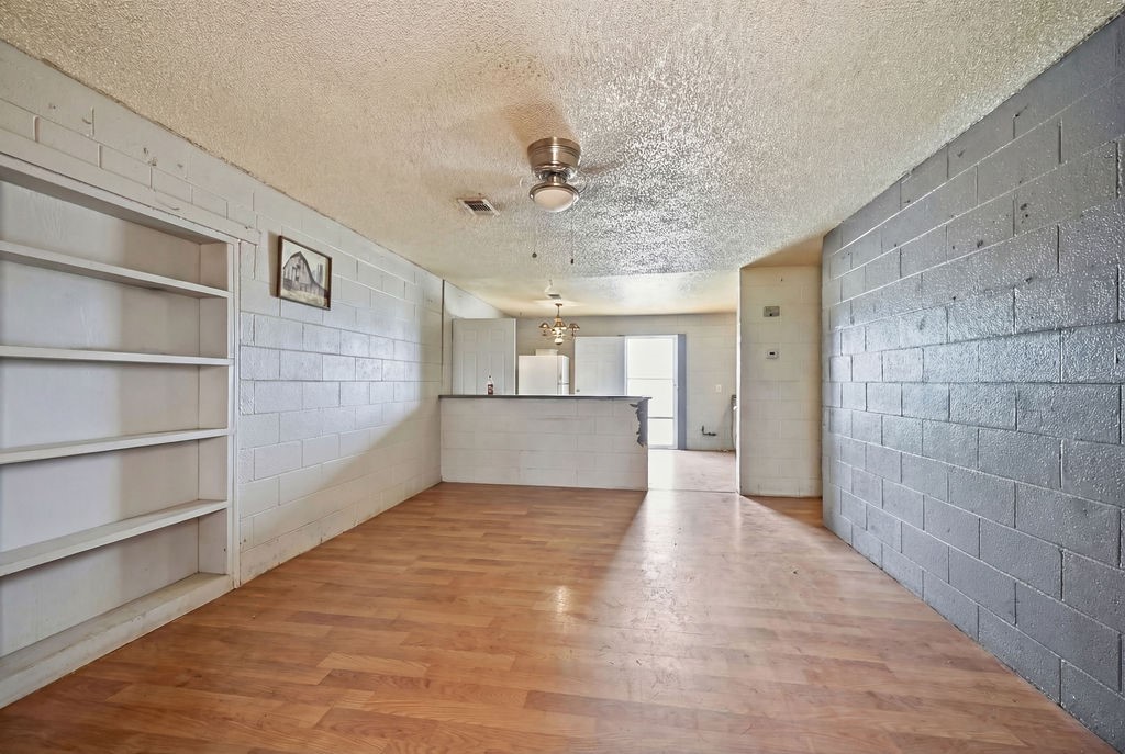 508 South Kenneth Avenue Monahans, TX 79756 - Photo 2 of 39 a view of a kitchen with a cabinet and a ceiling fan