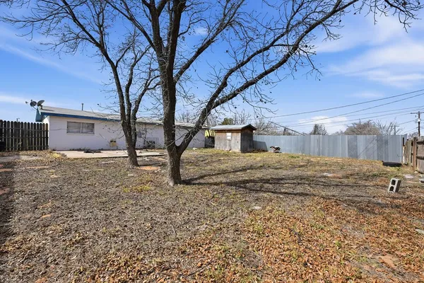 a house with trees in the background