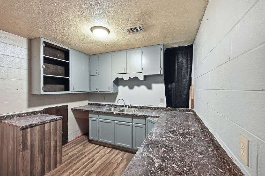508 South Kenneth Avenue Monahans, TX 79756 - Photo 10 of 39 a kitchen with stainless steel appliances granite countertop a stove a sink and a refrigerator