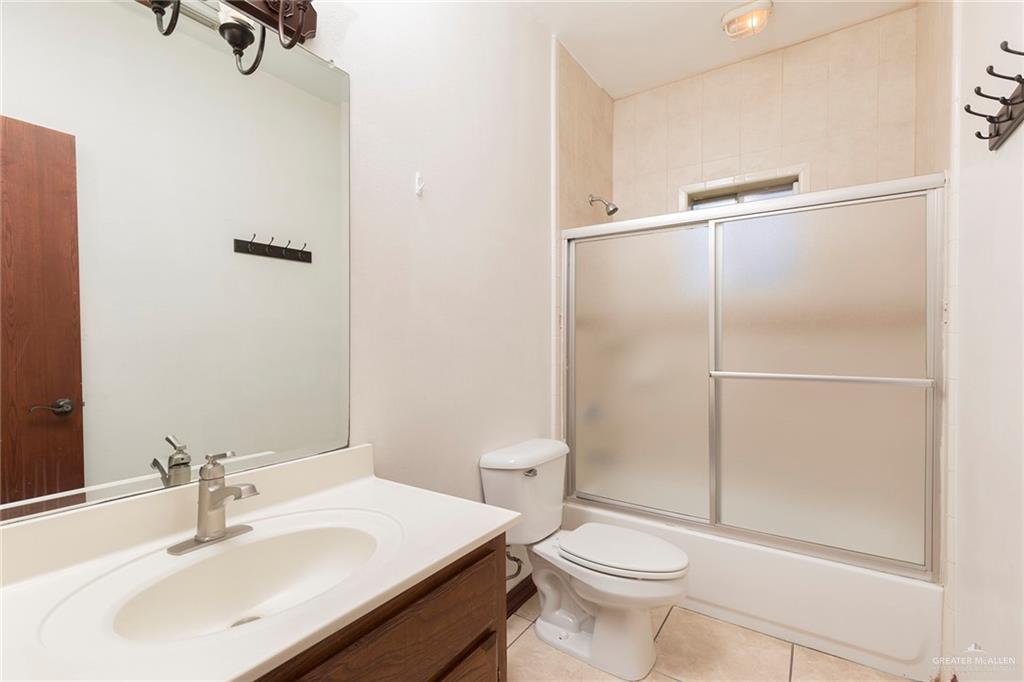 1213 Rhett Drive Pharr, TX 78577 - Photo 15 of 19 Full bathroom featuring a tub/shower combination and large vanity.